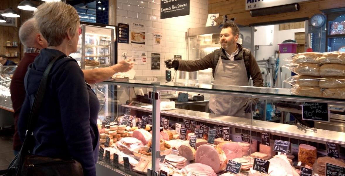 Arthur Strands trader serving customer Arthur Strands trader serving customer