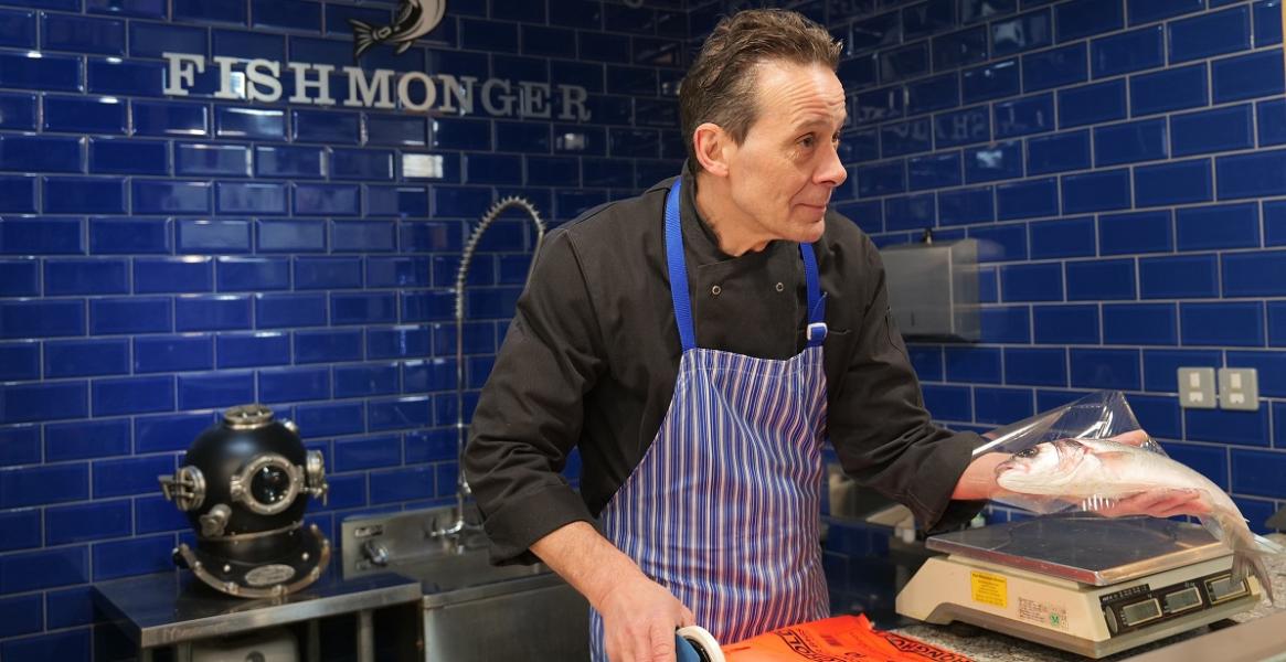 Mark Williams trader serving fish Trader serving fish