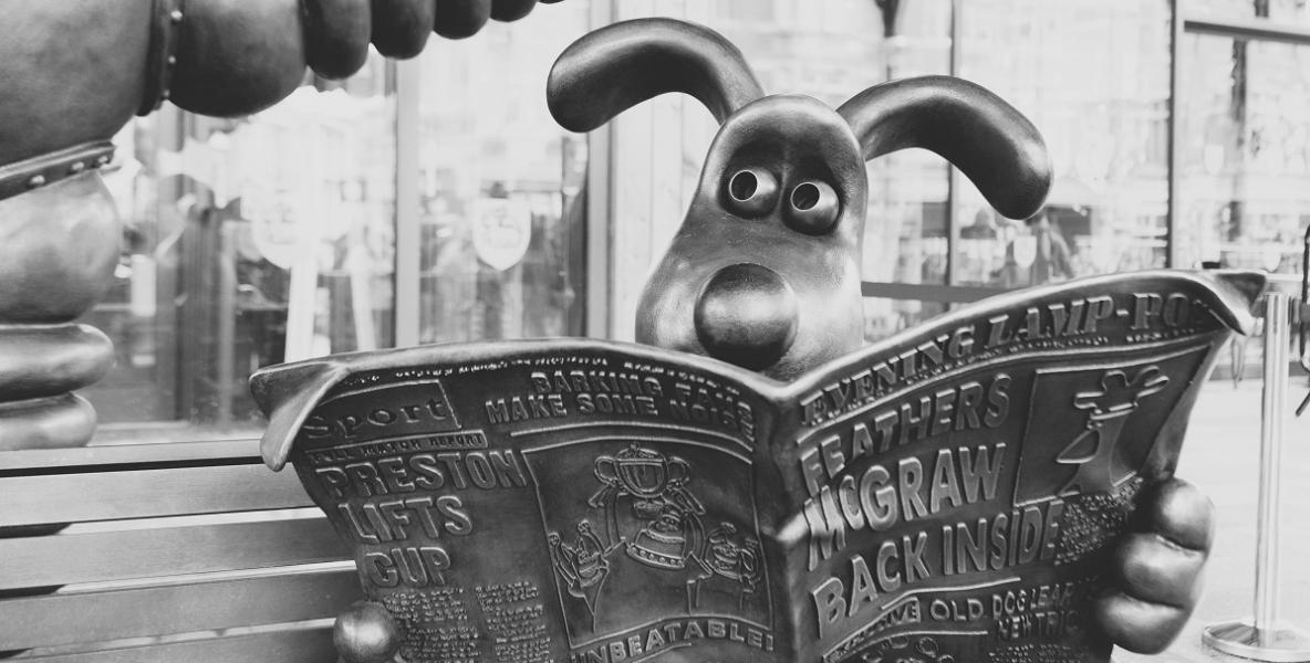 Gromit reading newspaper close up Gromit reading newspaper close up