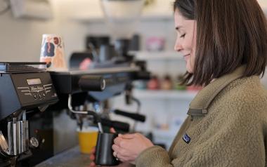 Trader making coffee