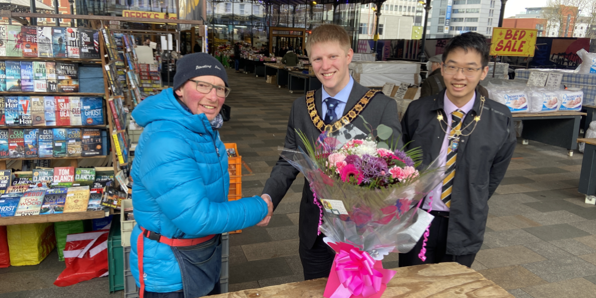 Book trader shaking hands with Mayor of Preston