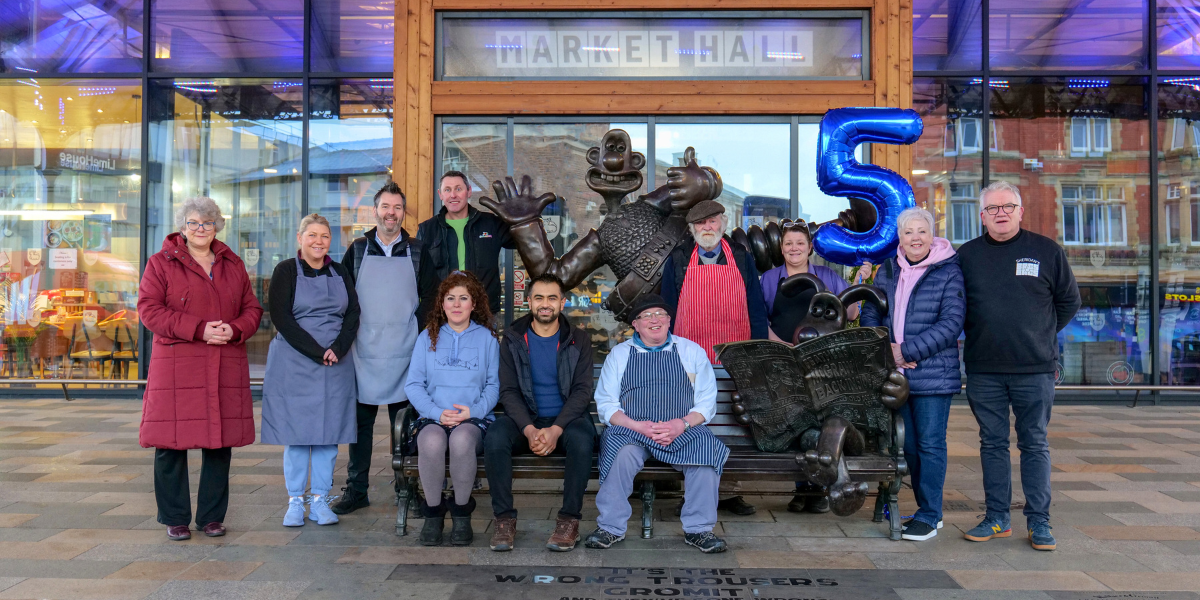 Traders outside Market Hall with balloon