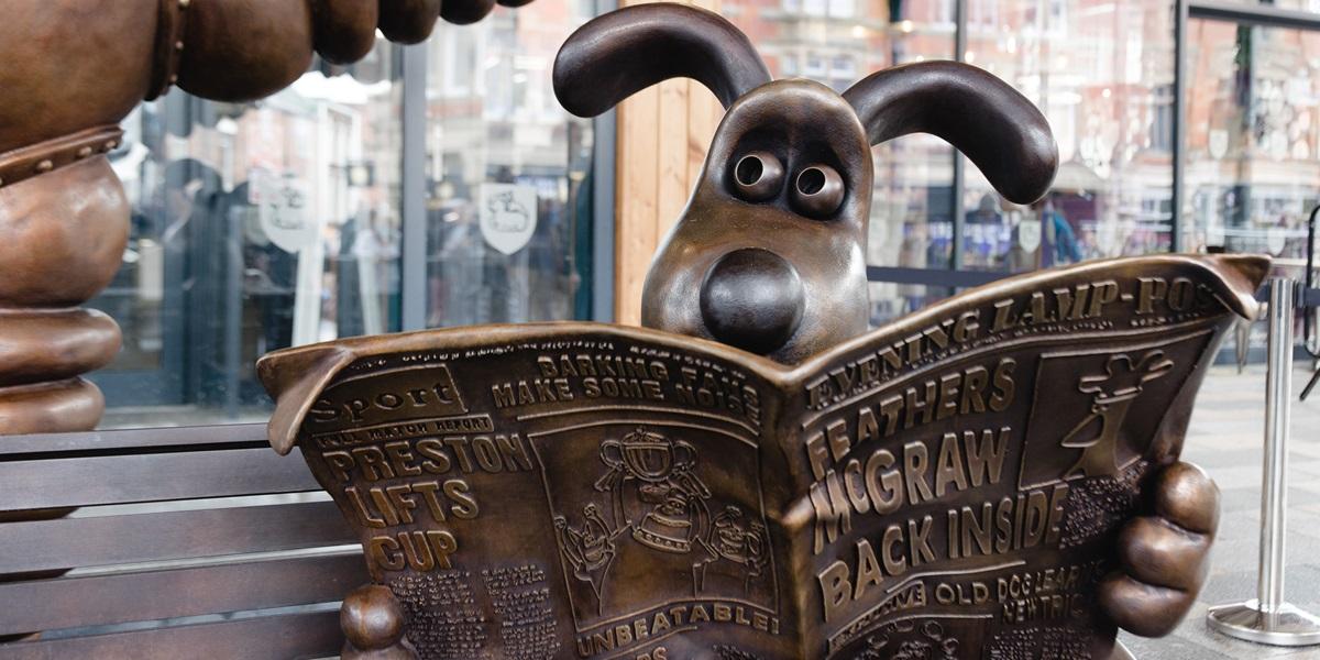 Gromit reading newspaper