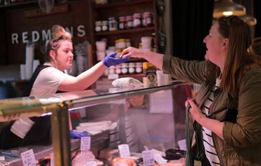 Close up of trader serving customer