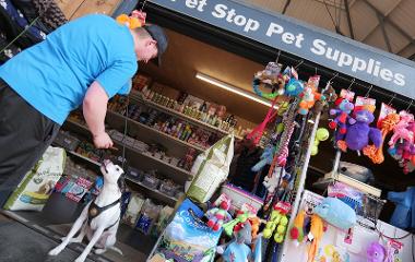 Customer feeding dog treat