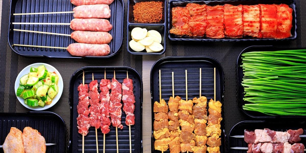 Assortment of BBQ food on skewers