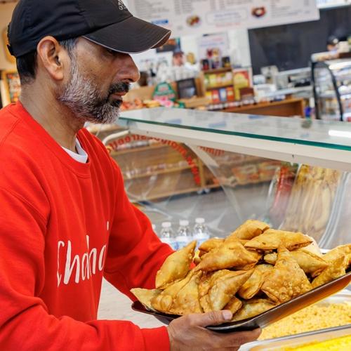 Chacha's trader with plate of samosas