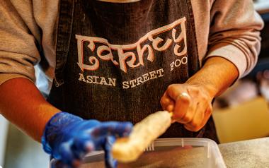 Lakhey Street Food logo on an apron